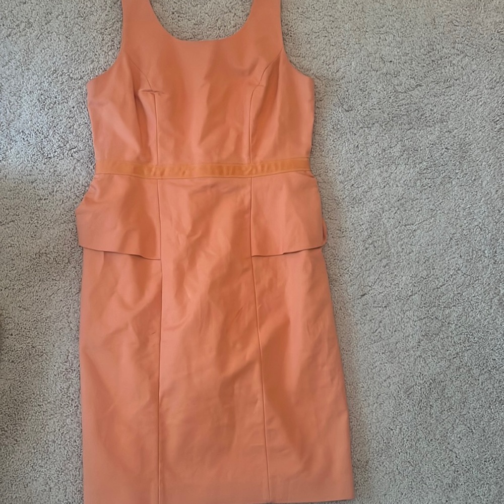 Coral Peplum dress. From the limited tags attached